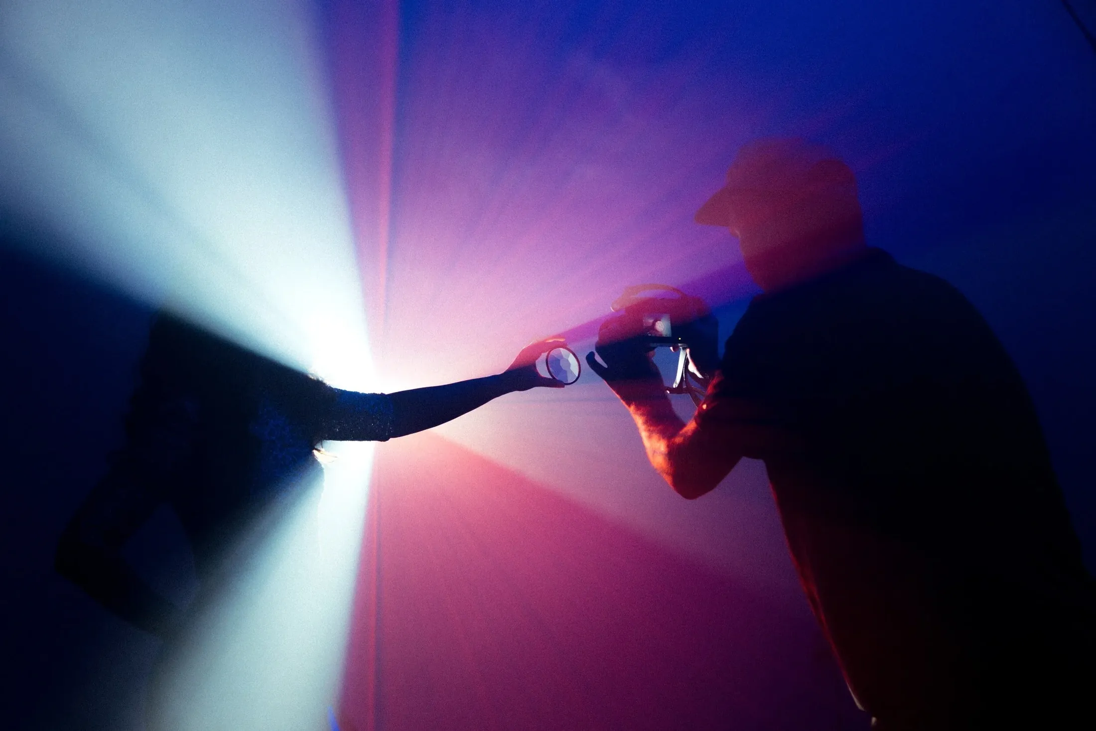 Light beams and a camera in a studio shoot